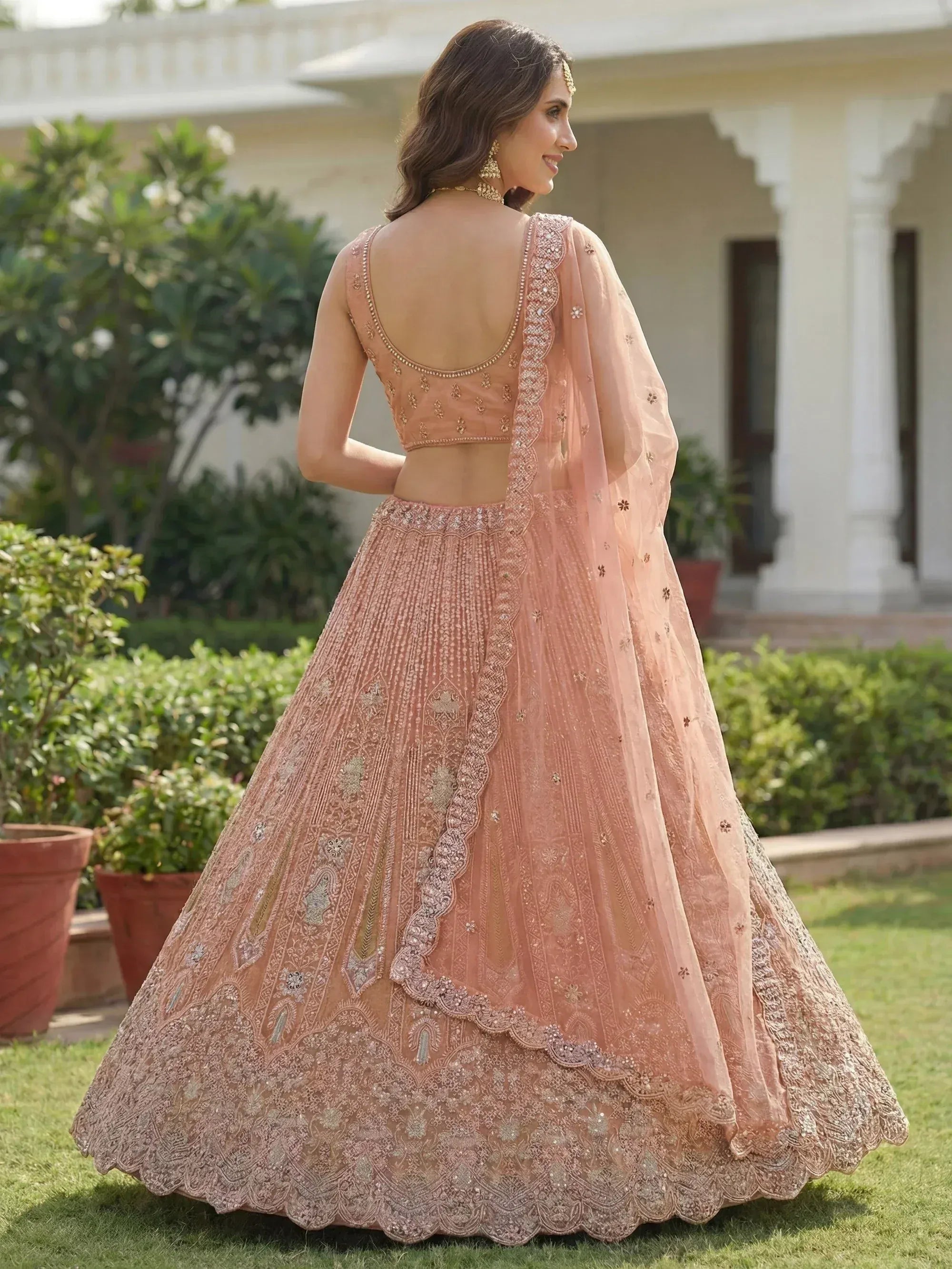 Glamorous Peach Dori Embroidered Net Wedding Wear Lehenga Choli
