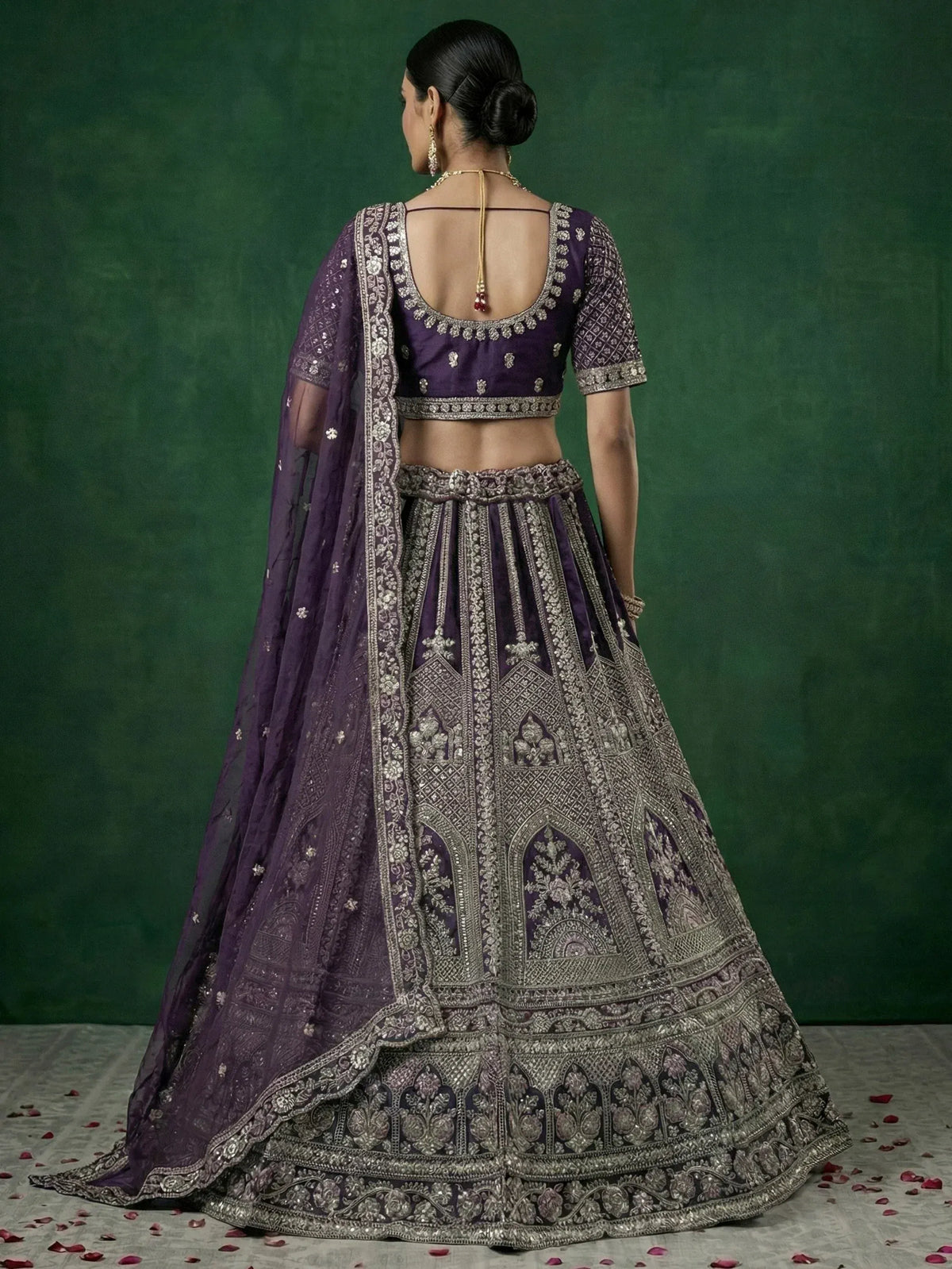 Purple designer lehenga choli with intricate silver embroidery and sheer dupatta