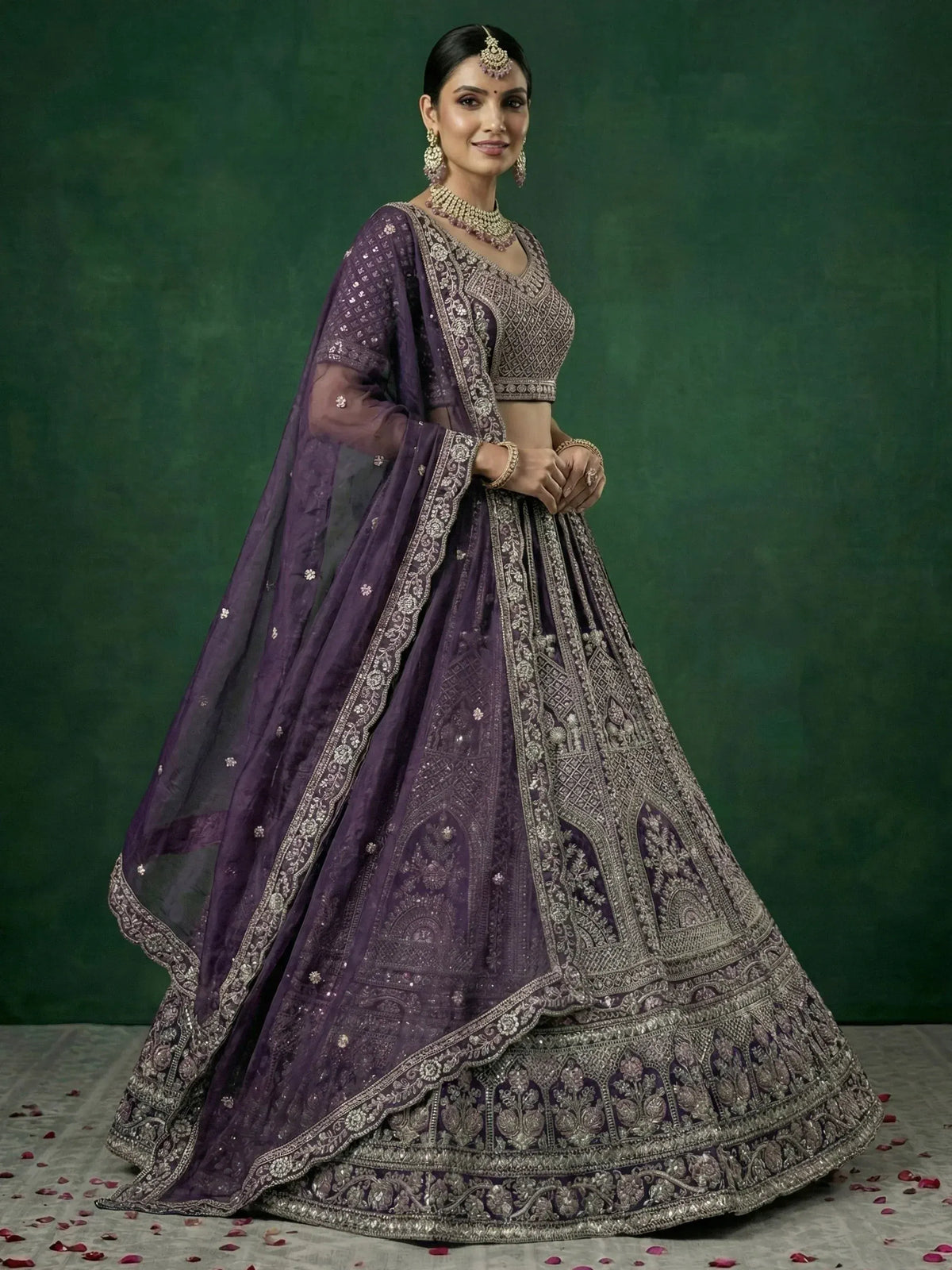 Purple embroidered lehenga choli with heavy silver zari work, perfect for weddings and festive occasions.