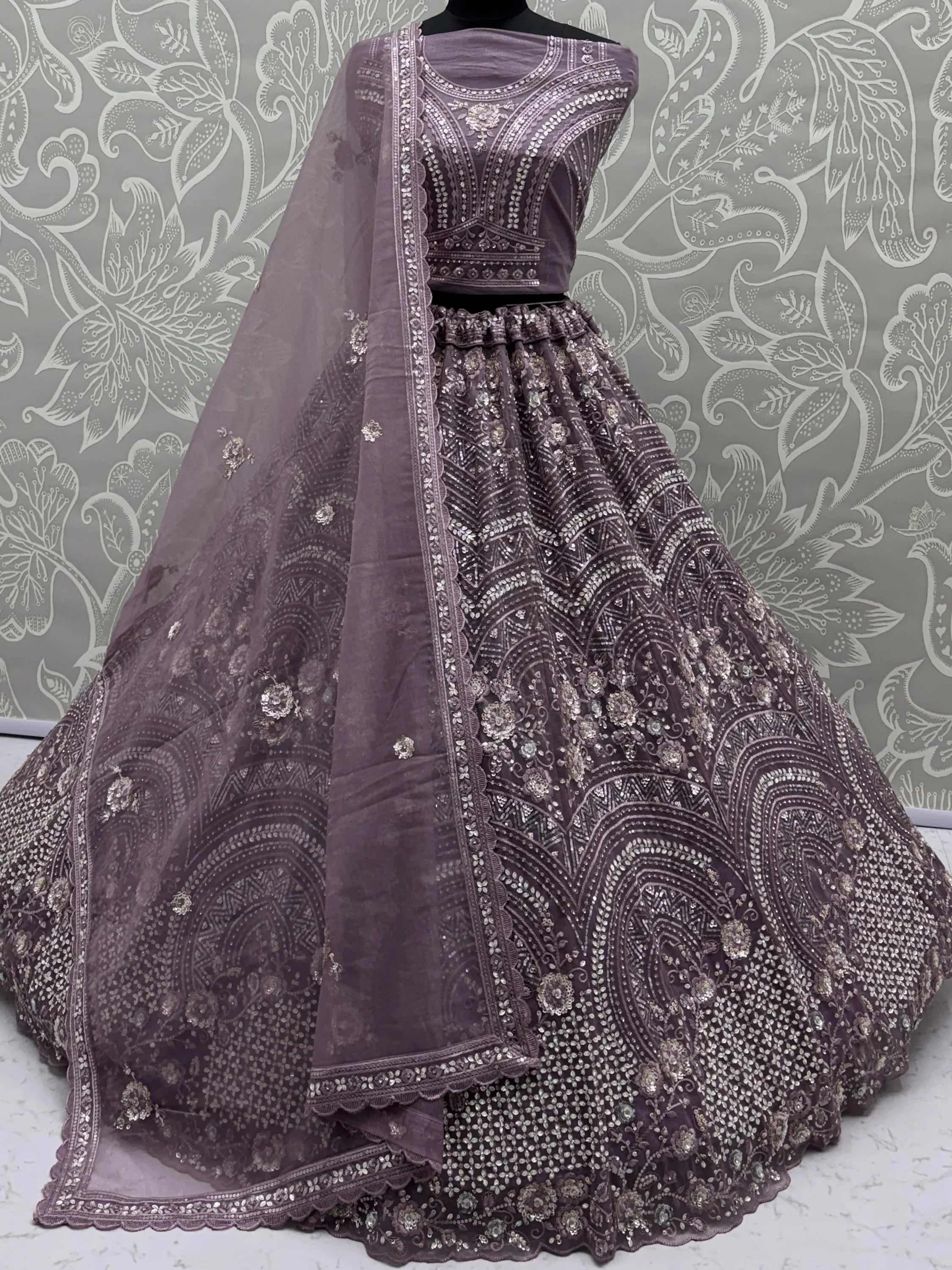Charming Purple Embroidered Net Engagement Wear Lehenga Choli