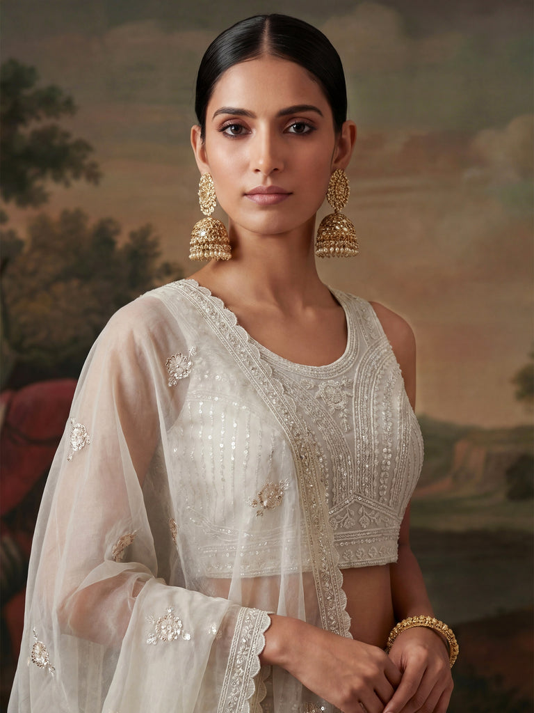 Stunning White Embroidered Net Sangeet Wear Lehenga Choli