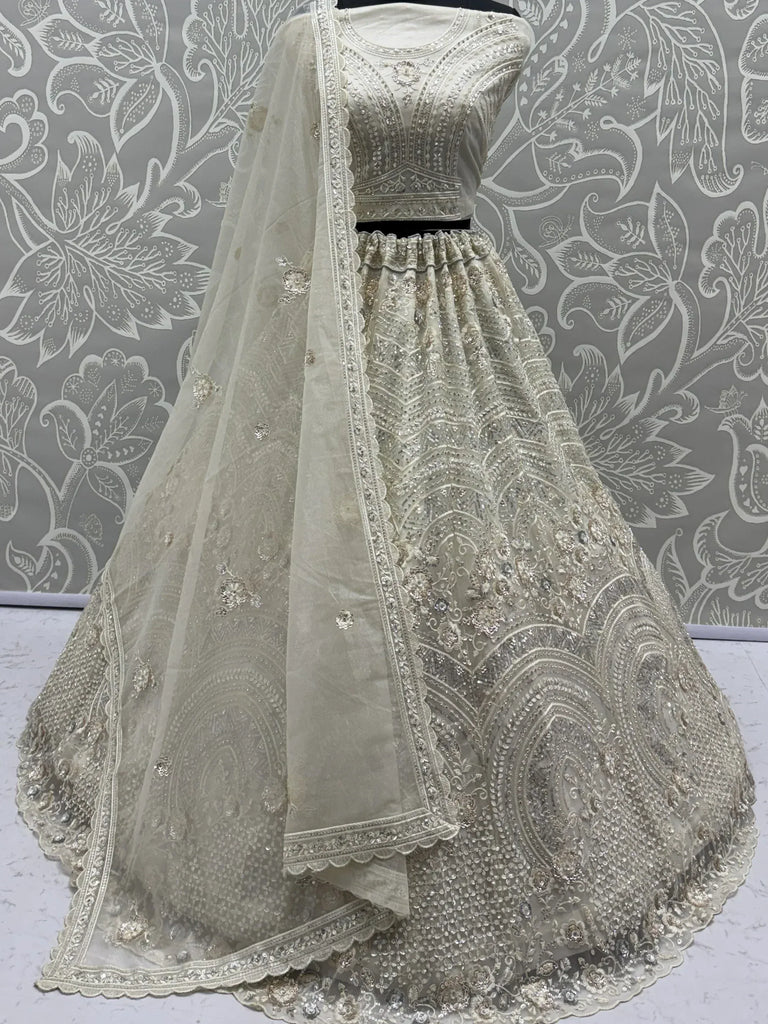 Stunning White Embroidered Net Sangeet Wear Lehenga Choli