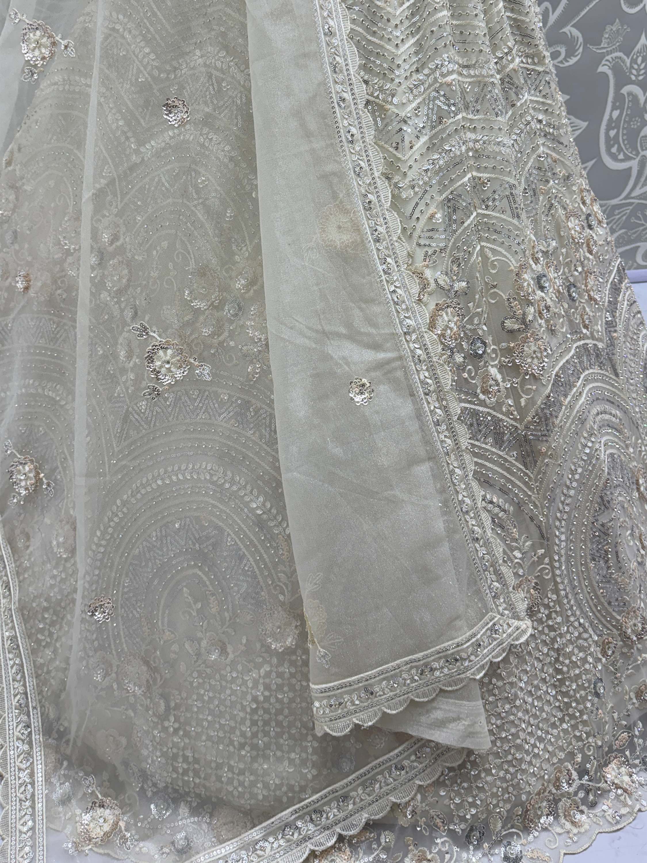 Stunning White Embroidered Net Sangeet Wear Lehenga Choli