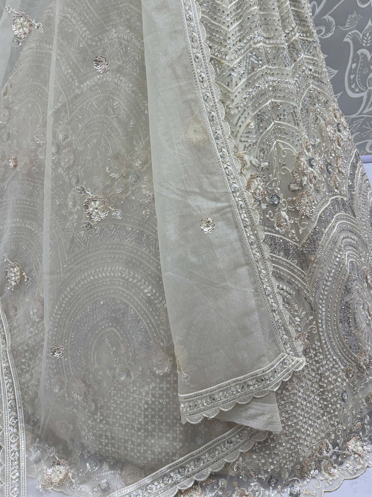 Stunning White Embroidered Net Sangeet Wear Lehenga Choli
