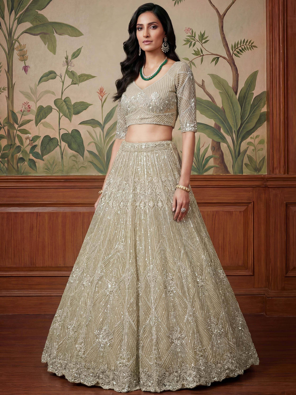 Elegant beige embroidered lehenga choli with sequins, perfect for Indian weddings and festive occasions.