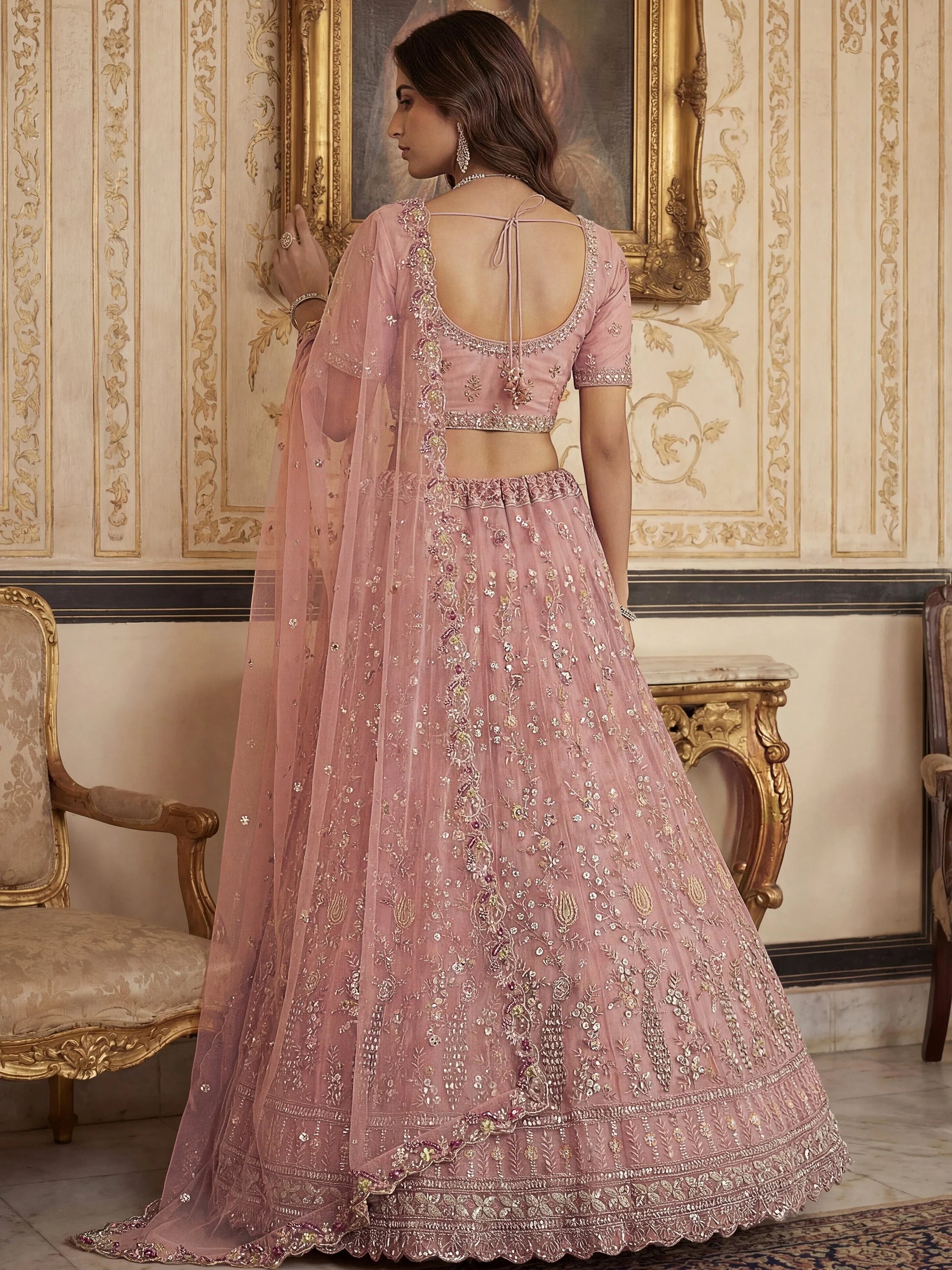 Captivating Peach Embroidered Net Wedding Wear Lehenga Choli