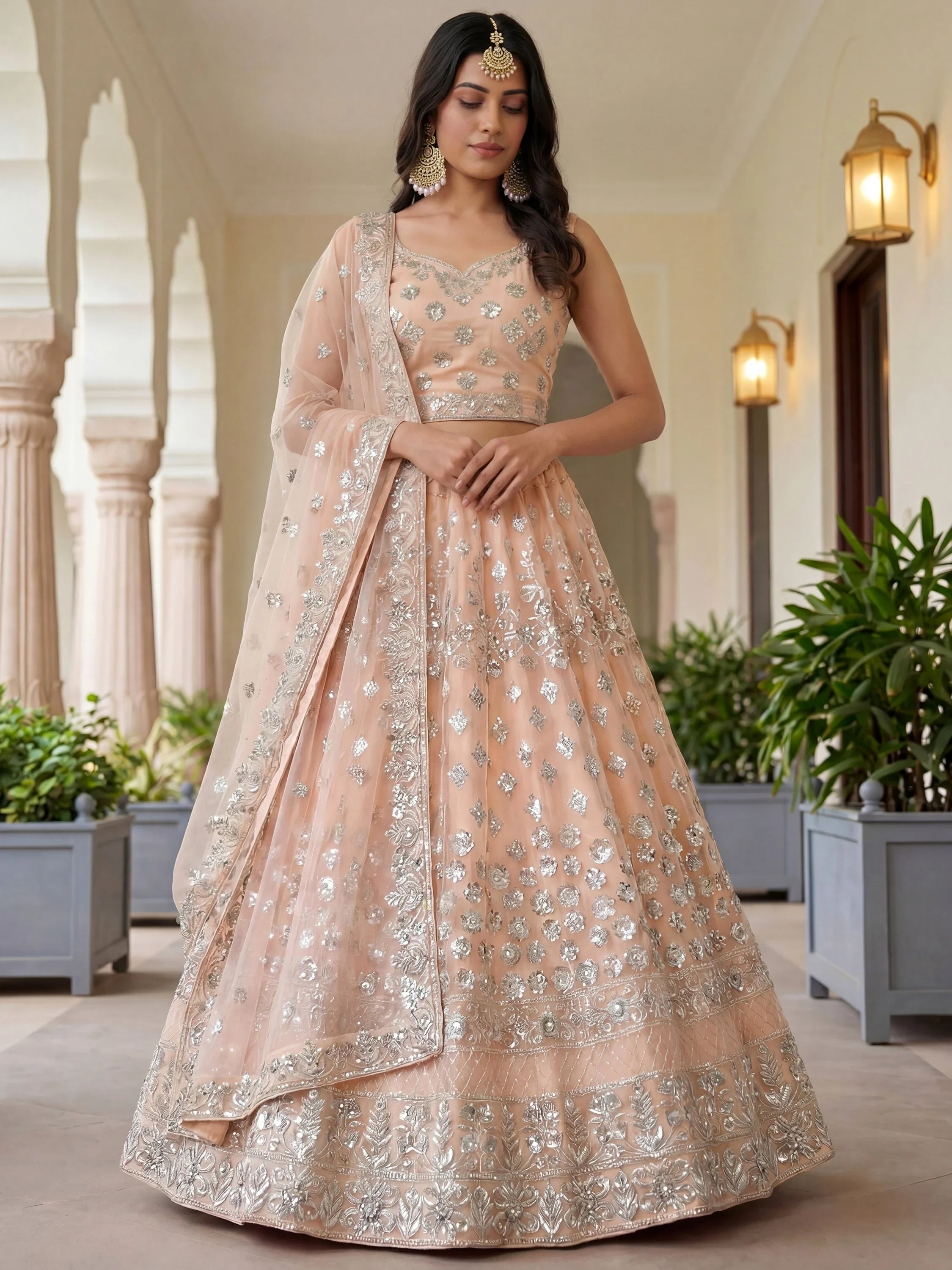 Dazzling Peach Sequins Net Engagement Wear Lehenga Choli
