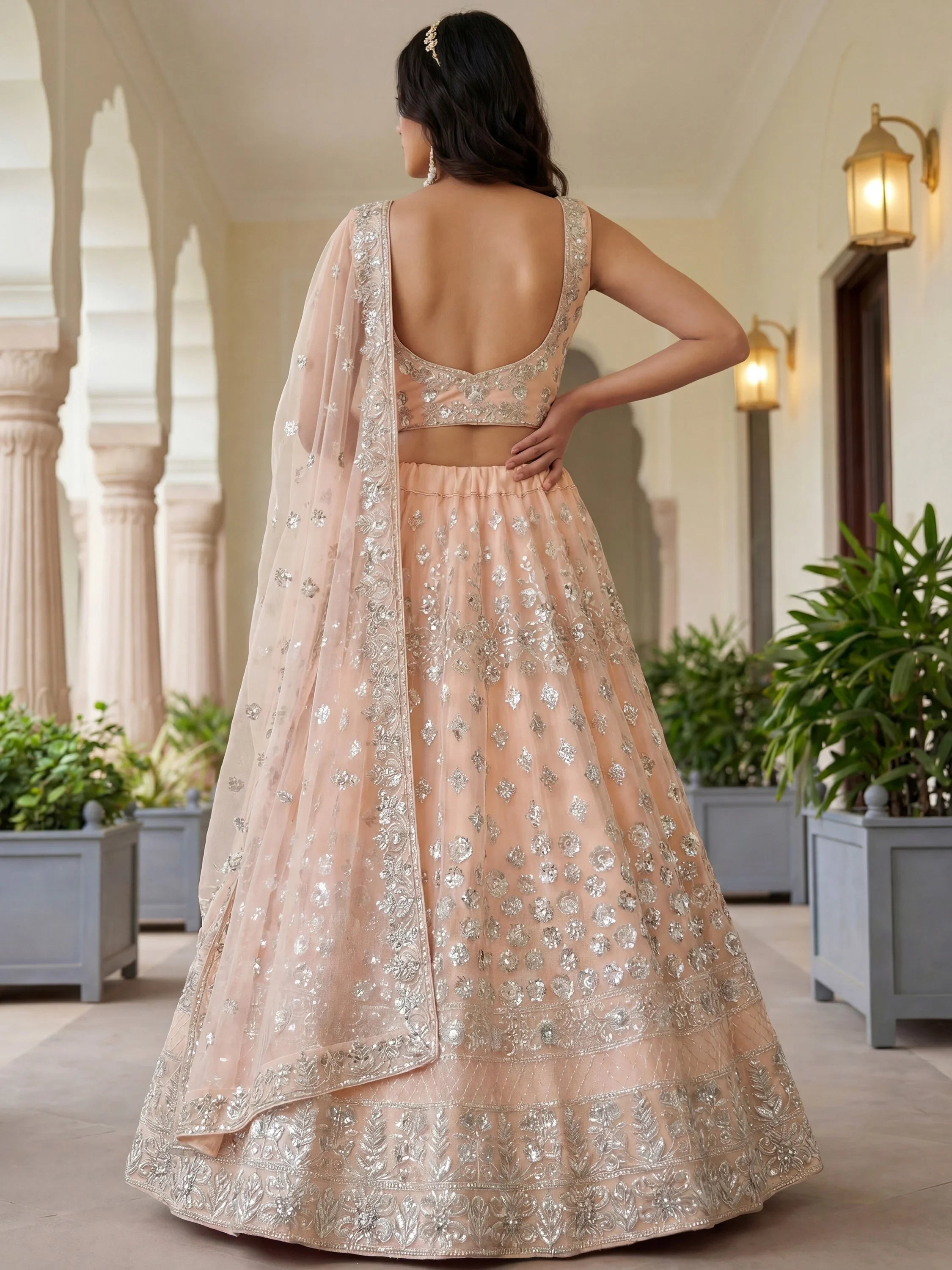 Dazzling Peach Sequins Net Engagement Wear Lehenga Choli