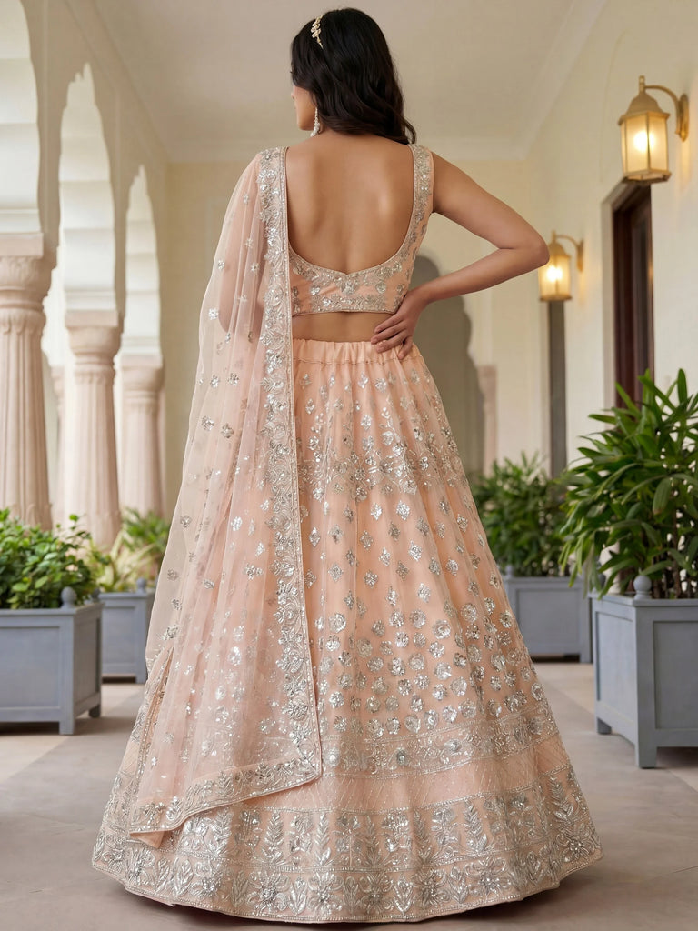 Dazzling Peach Sequins Net Engagement Wear Lehenga Choli