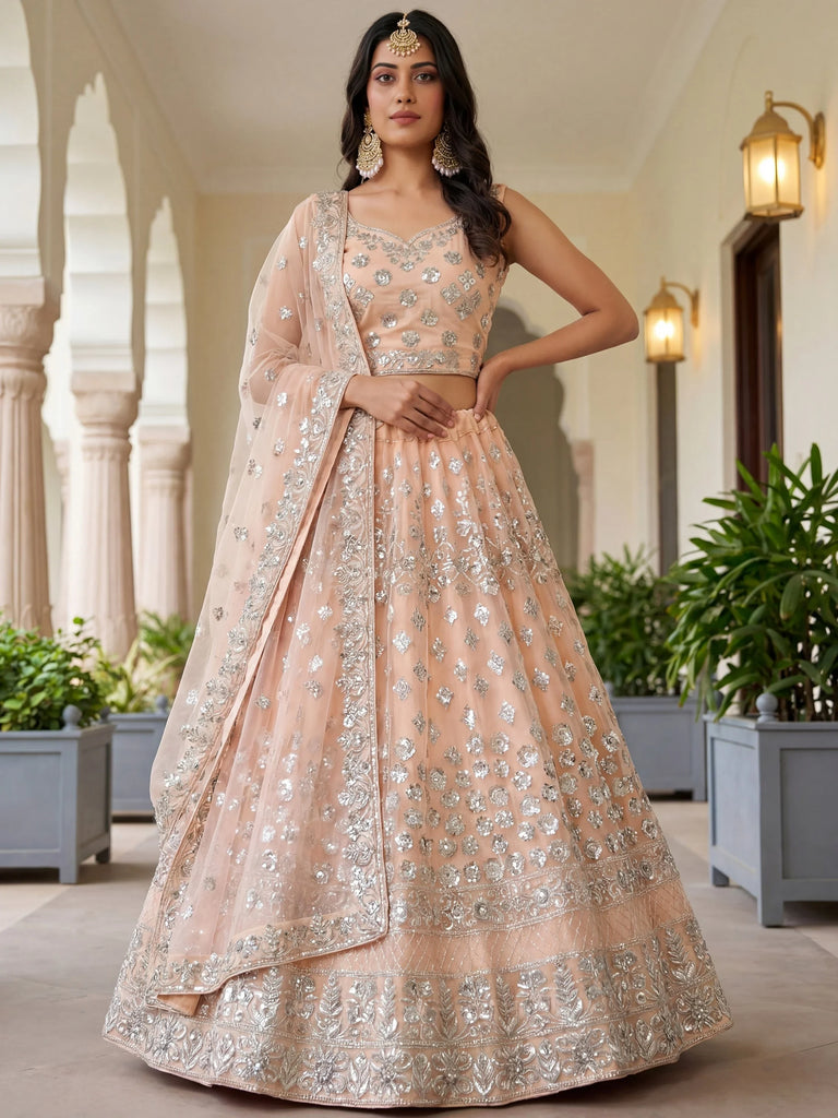 Dazzling Peach Sequins Net Engagement Wear Lehenga Choli
