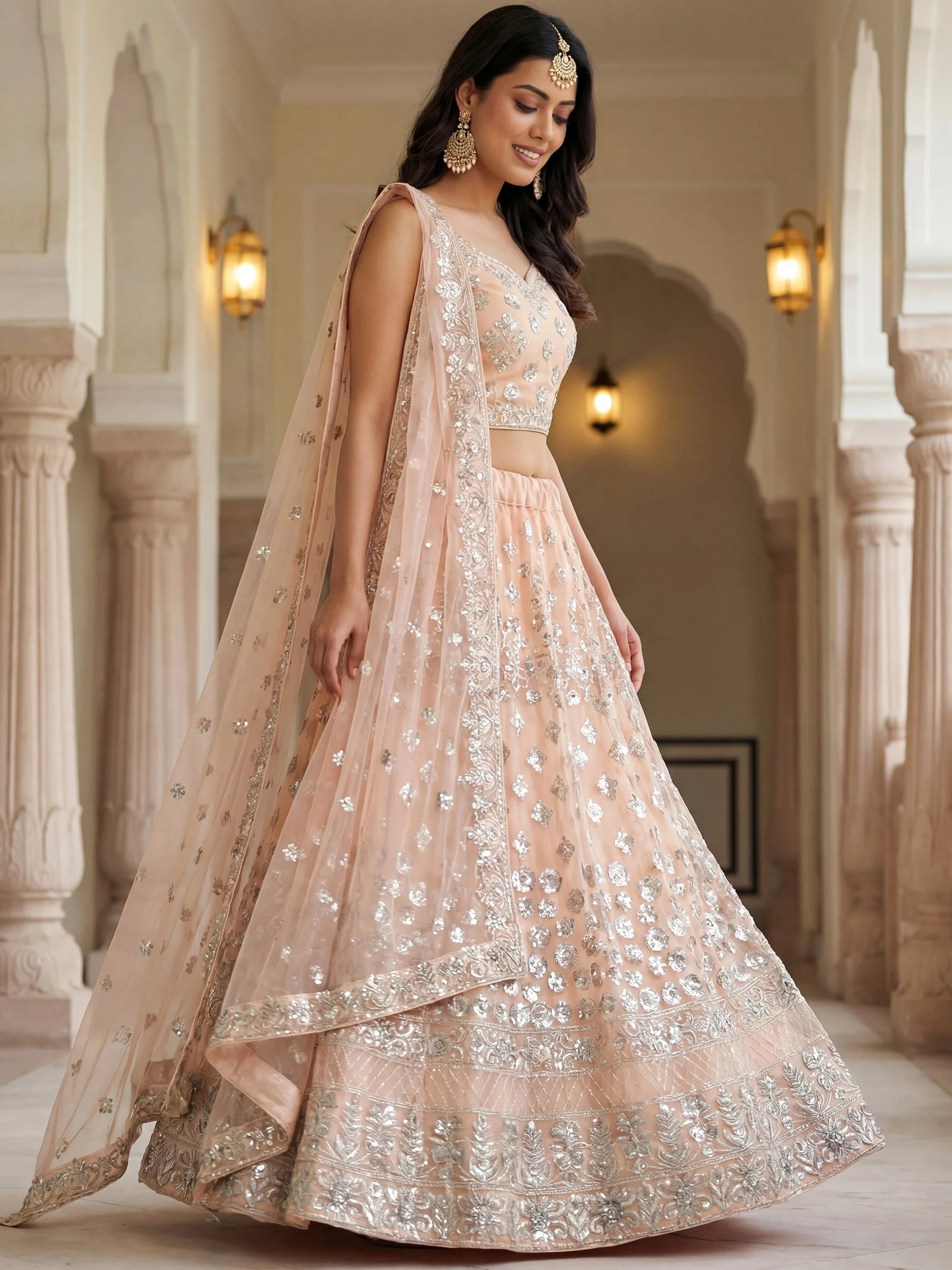 Dazzling Peach Sequins Net Engagement Wear Lehenga Choli