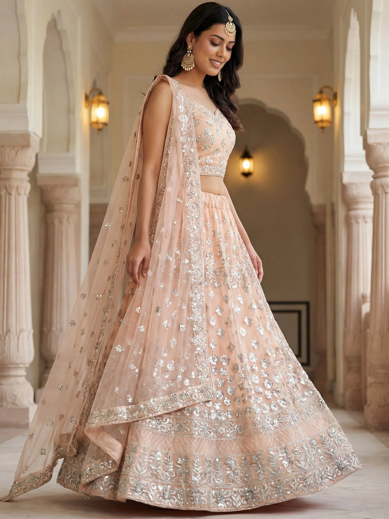 Dazzling Peach Sequins Net Engagement Wear Lehenga Choli