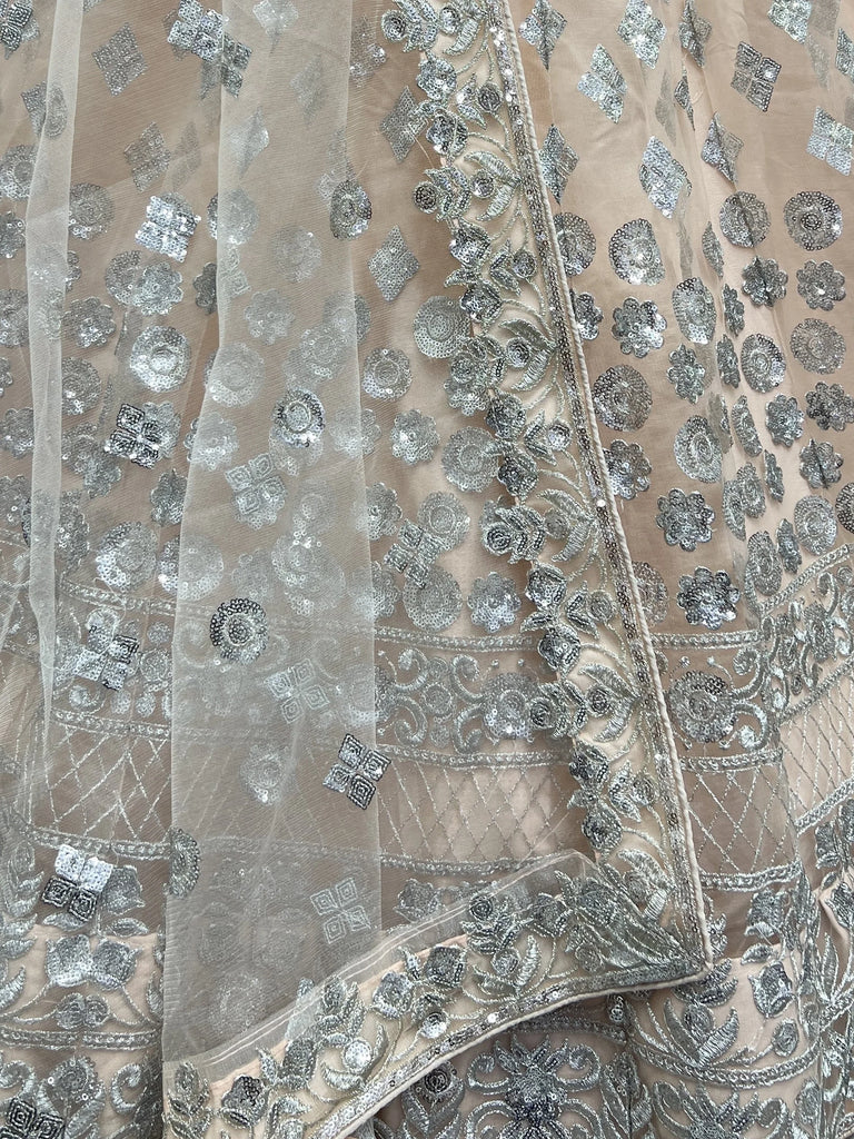 Dazzling Peach Sequins Net Engagement Wear Lehenga Choli
