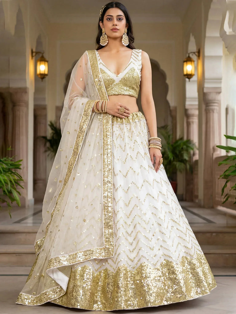 White and gold sequin lehenga choli with chevron pattern, perfect for Indian weddings and festive occasions.