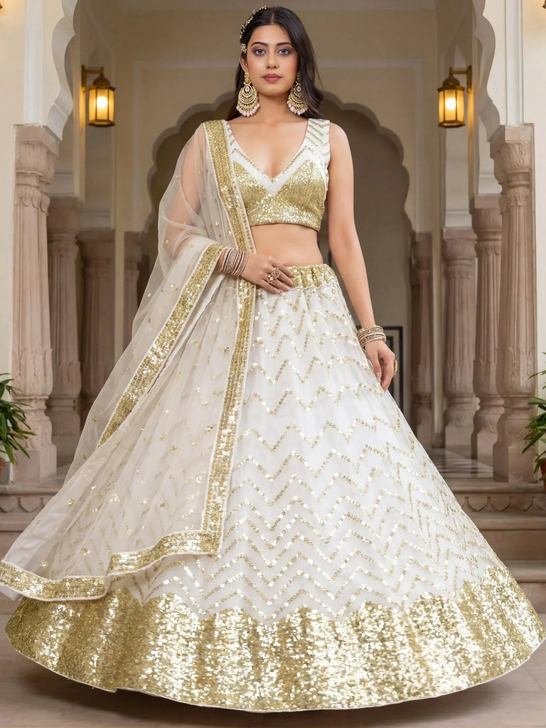 White and gold sequin lehenga choli with chevron pattern, perfect for Indian weddings and festive occasions