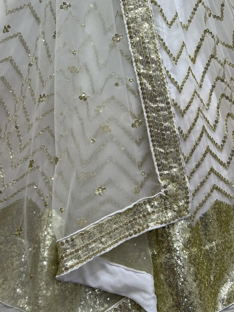 White and gold sequin ethnic wear with geometric patterns and floral embroidery details