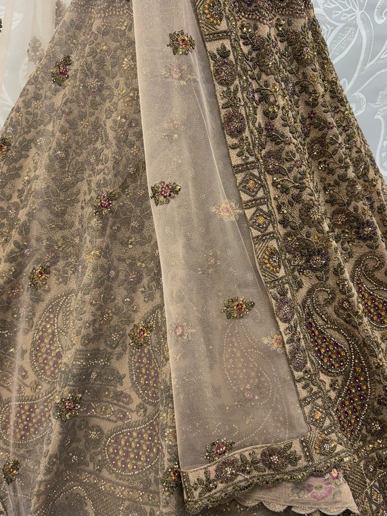 Grand Beige Zari Embroidery Net Sangeet Wear Lehenga Choli With Dupatta