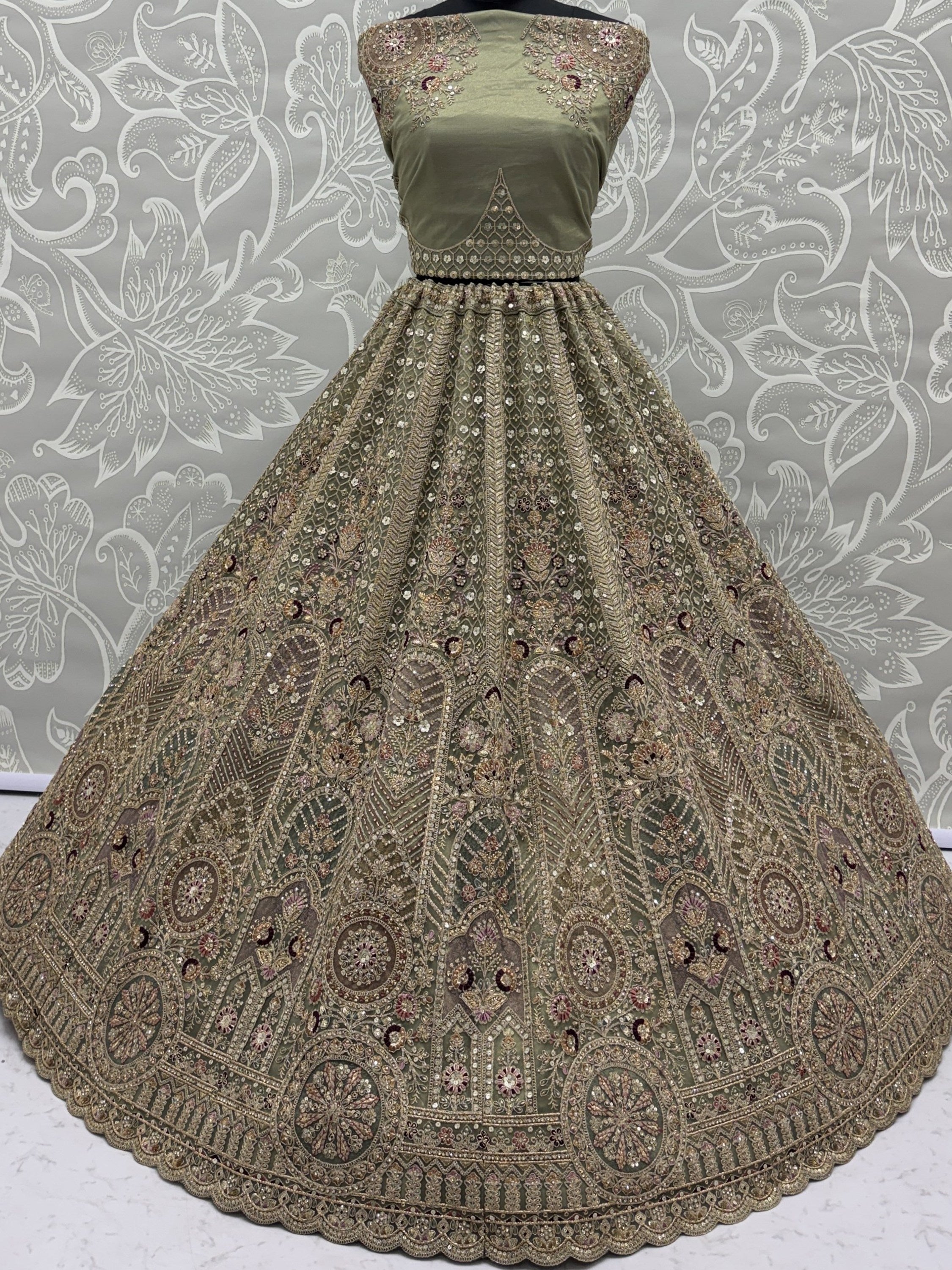 Ravishing Green Heavy Embroidered Net Evening Wear Lehenga Choli