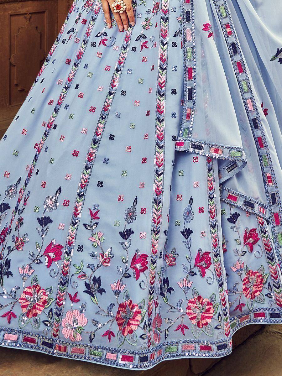 Light blue designer lehenga with floral embroidery and mirror work, perfect for Indian ethnic wear occasions