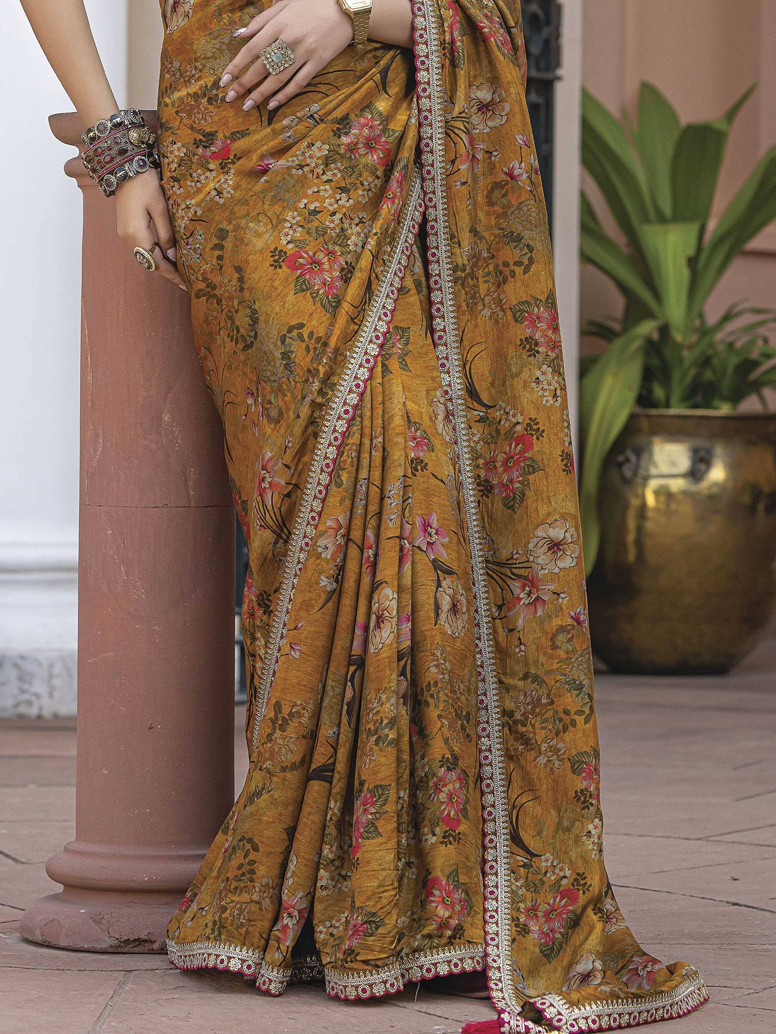 Mustard floral saree with embroidered border, styled with ethnic jewelry for Indian ethnic wear