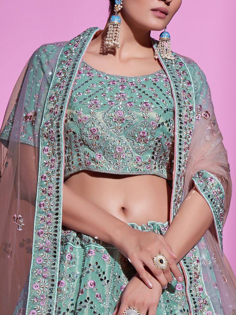 Mint green embroidered lehenga choli with floral motifs and sheer dupatta, perfect for Indian ethnic wear occasions.