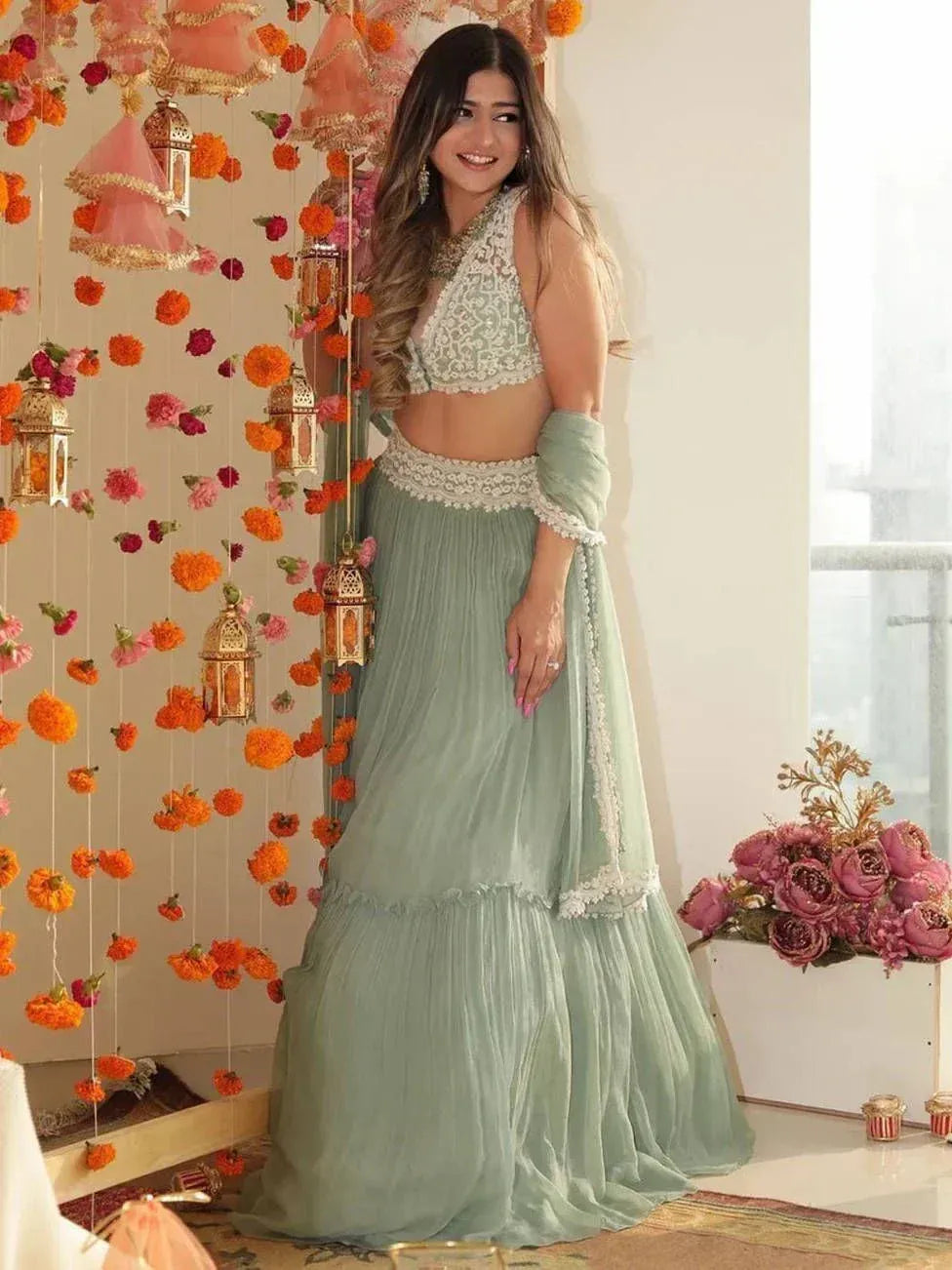 Mint green designer lehenga choli with lace detailing, perfect for Indian ethnic wear occasions
