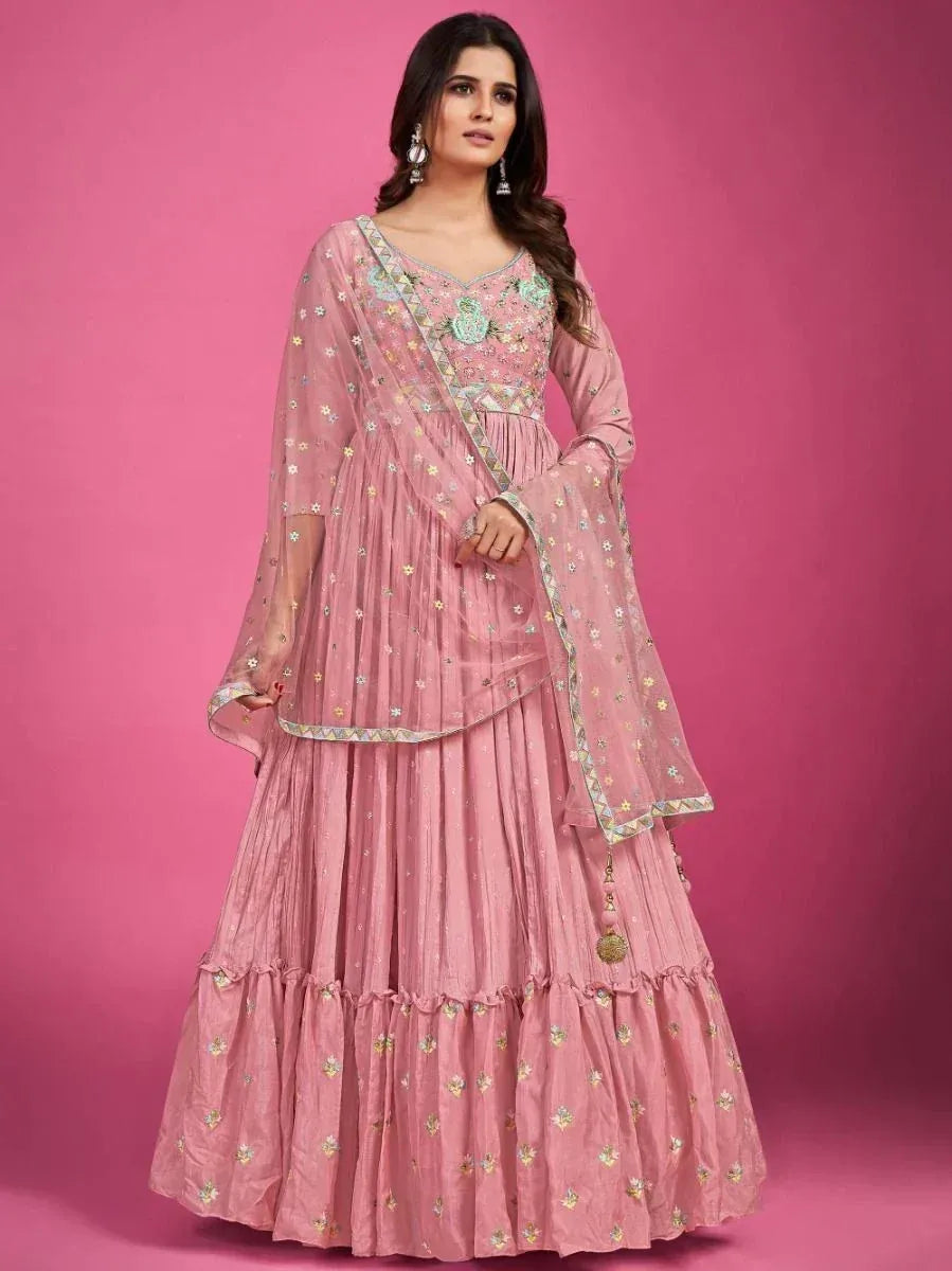 Pink embroidered lehenga choli with floral motifs and sheer dupatta, ideal for Indian ethnic occasions