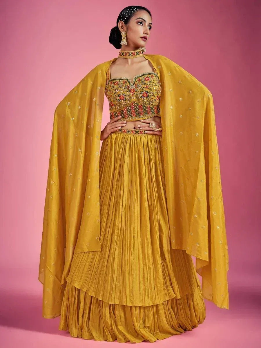 Mustard yellow embroidered lehenga choli with cape, perfect for Indian ethnic occasions