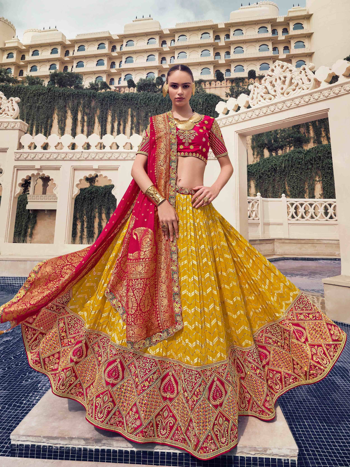 Elegant red and gold lehenga choli with intricate embroidery, perfect for Indian weddings and festive occasions.