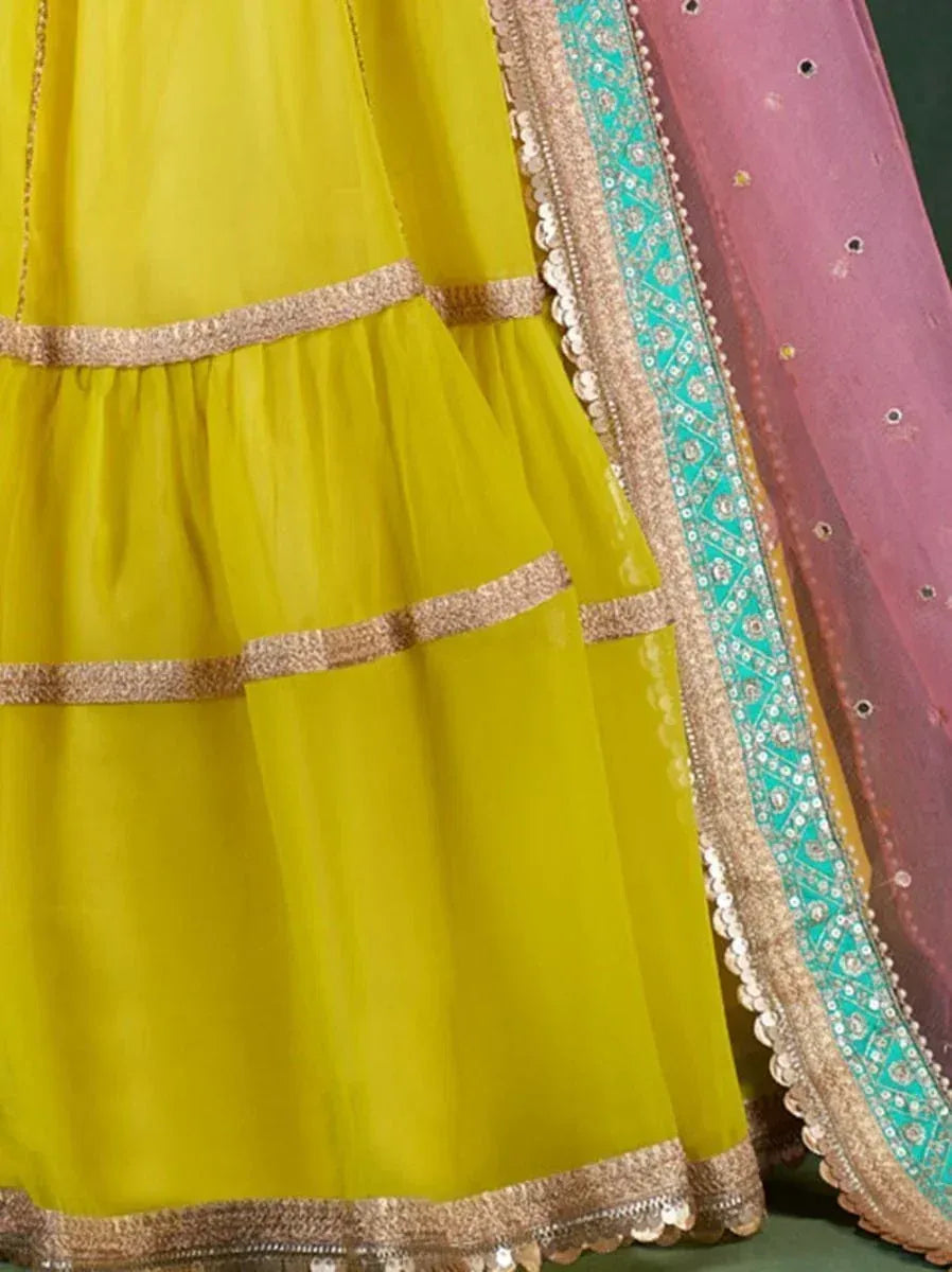 Vibrant yellow lehenga with gold trim and turquoise dupatta, ethnic Indian wear