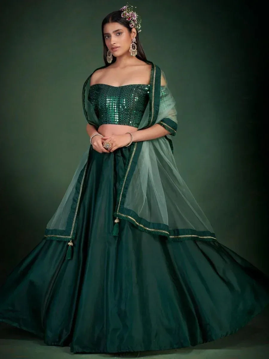 Emerald green sequin lehenga choli with sheer dupatta, perfect for Indian ethnic wear events