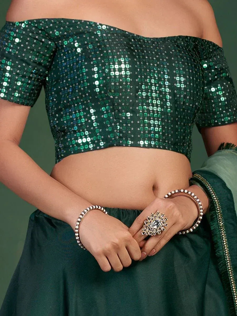 Emerald green sequin off-shoulder blouse with matching lehenga, perfect for Indian ethnic wear occasions