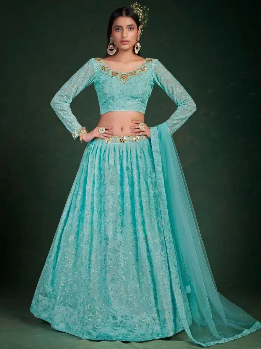 Turquoise designer lehenga choli with gold embroidery, perfect for Indian weddings and festive occasions.