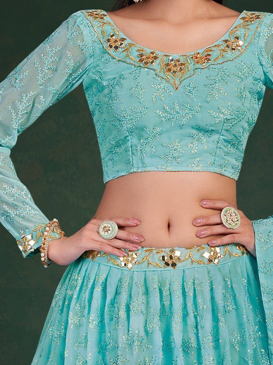 Turquoise embroidered lehenga choli with gold floral detailing and sheer sleeves, perfect for Indian ethnic wear.