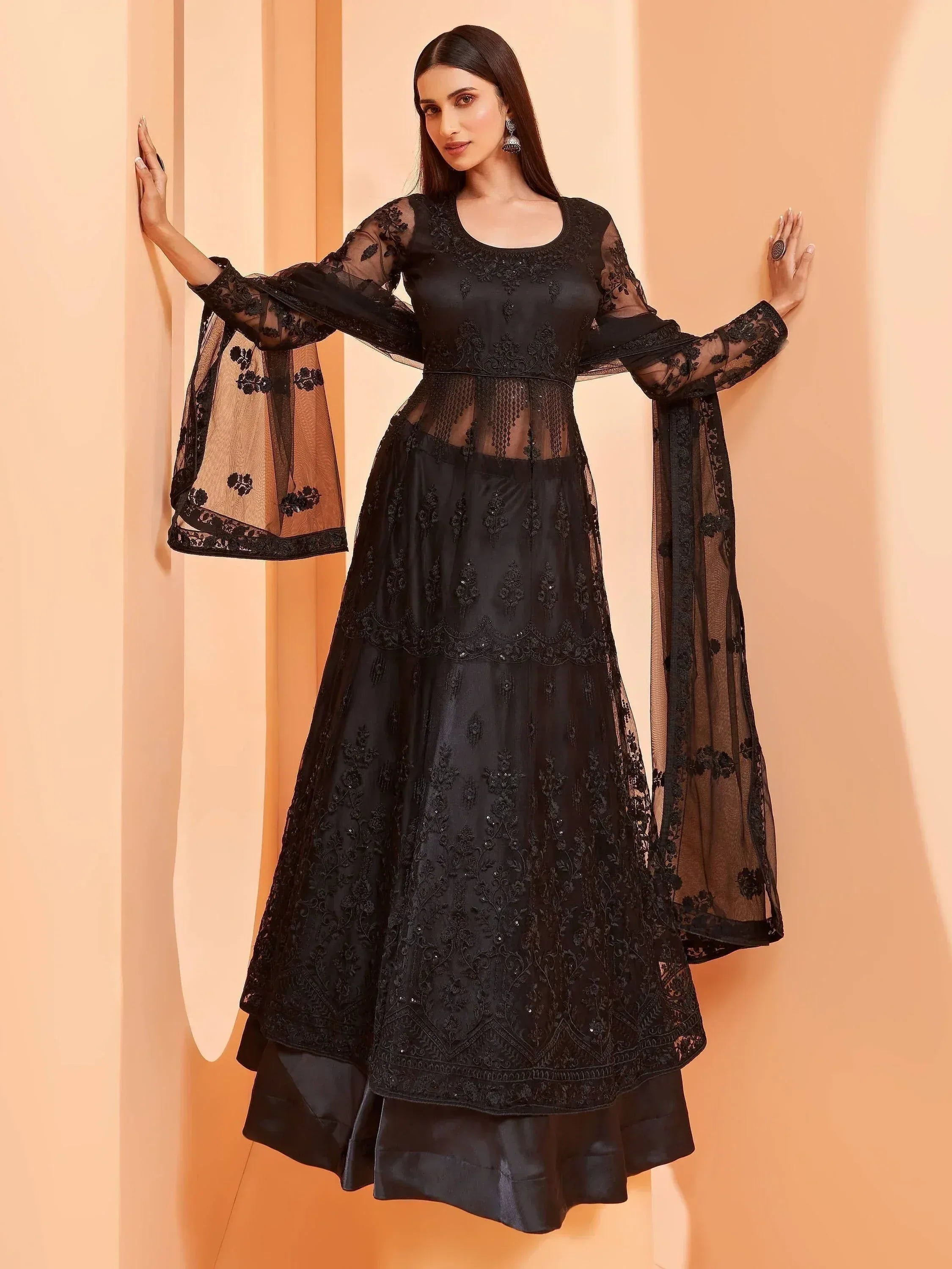 Elegant black embroidered anarkali with sheer sleeves and flared skirt for ethnic occasions