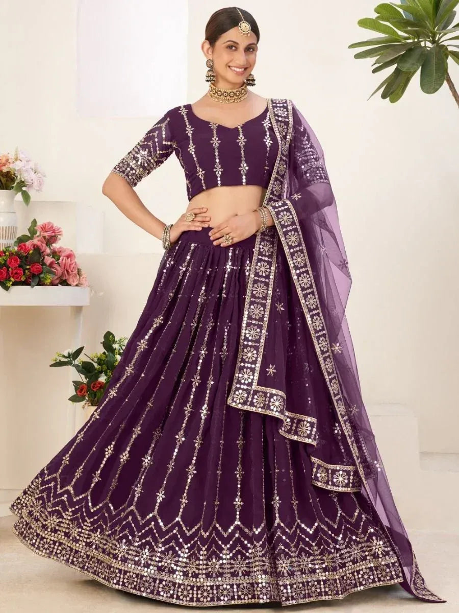 Purple designer lehenga choli with gold mirror work and sheer dupatta, perfect for Indian weddings and festive occasions