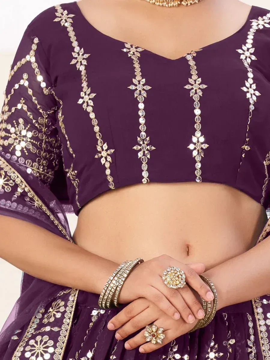 Purple embroidered lehenga choli with gold mirror work and floral detailing, perfect for Indian ethnic wear