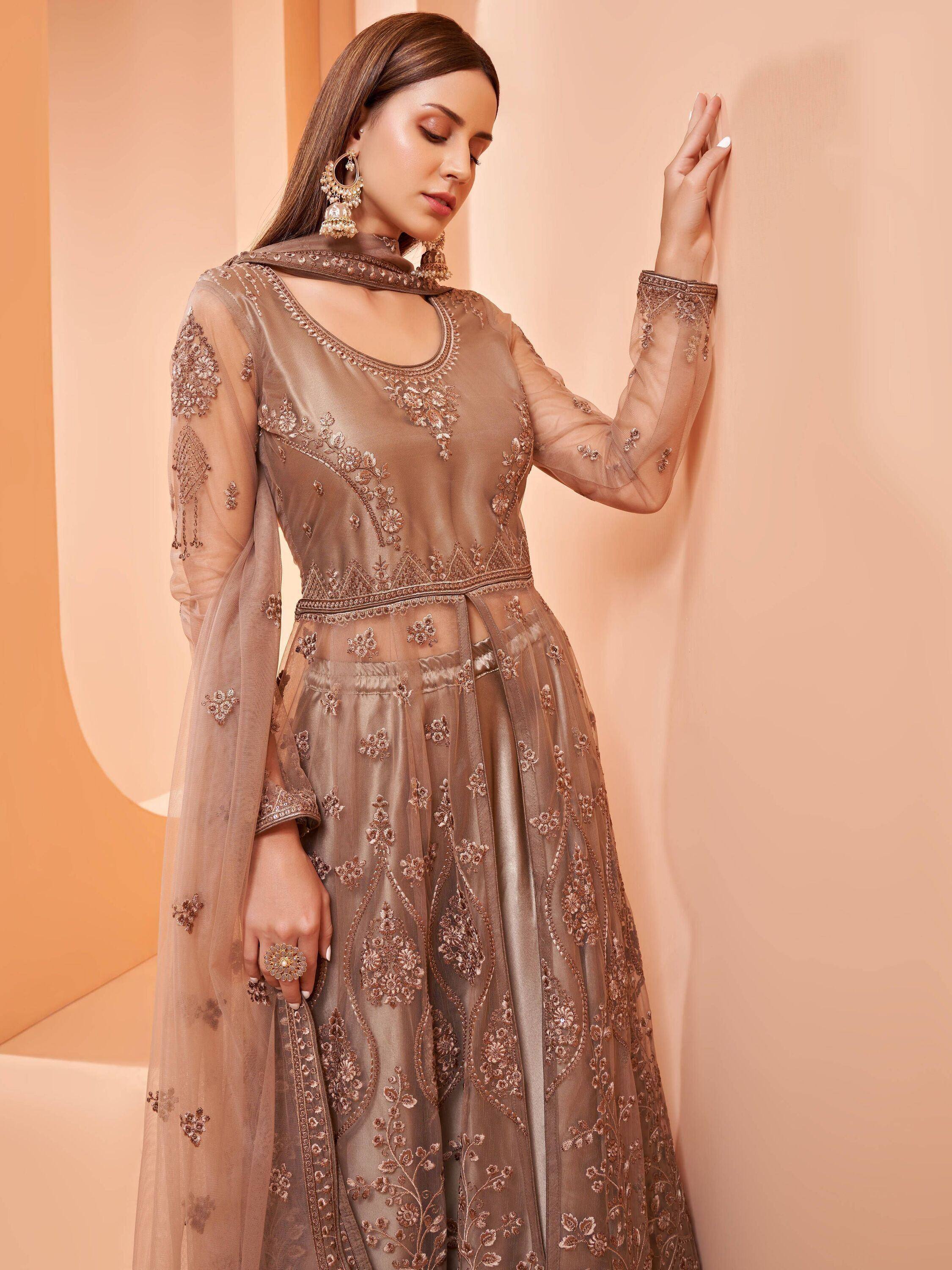 Elegant brown embroidered anarkali suit with sheer sleeves and dupatta, perfect for Indian ethnic occasions.