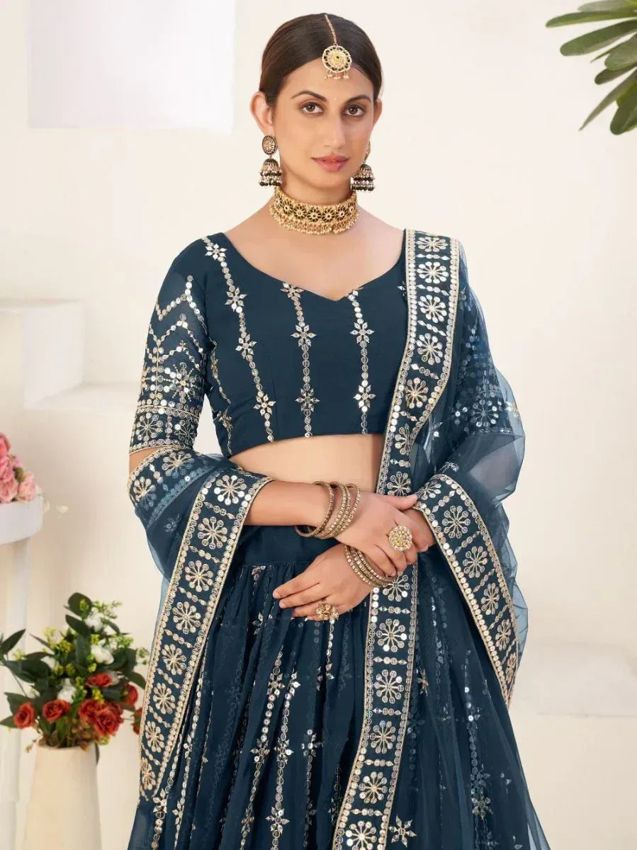 Navy blue designer lehenga choli with gold mirror work and floral embroidery, perfect for Indian ethnic wear