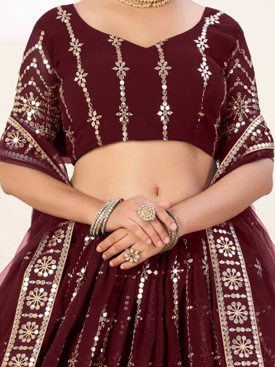 Maroon designer lehenga choli with gold mirror work and floral embroidery, perfect for Indian ethnic wear
