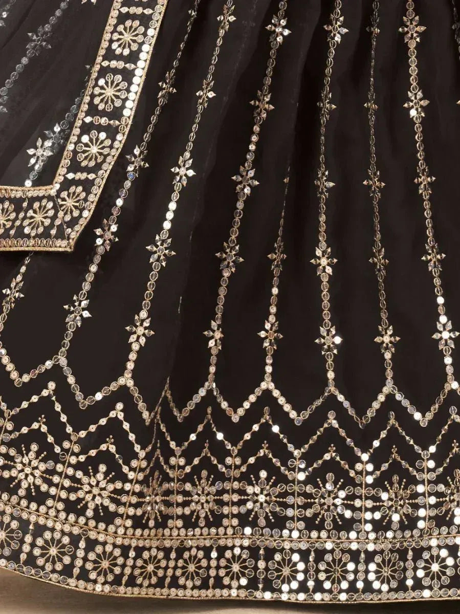 Black designer lehenga with intricate gold mirror work and floral embroidery, perfect for Indian ethnic wear.