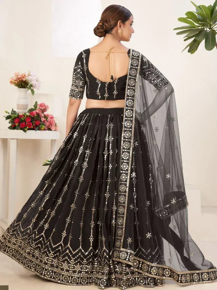 Black designer lehenga choli with mirror work and sheer dupatta, ethnic wear for women