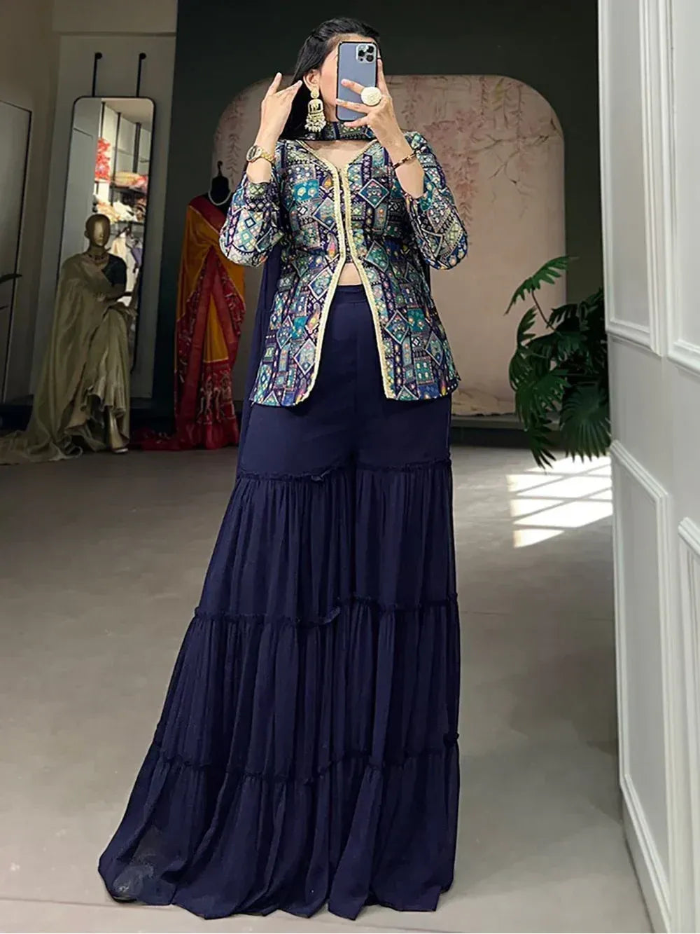 Woman in printed ethnic jacket with navy tiered palazzo pants, Indian designer wear