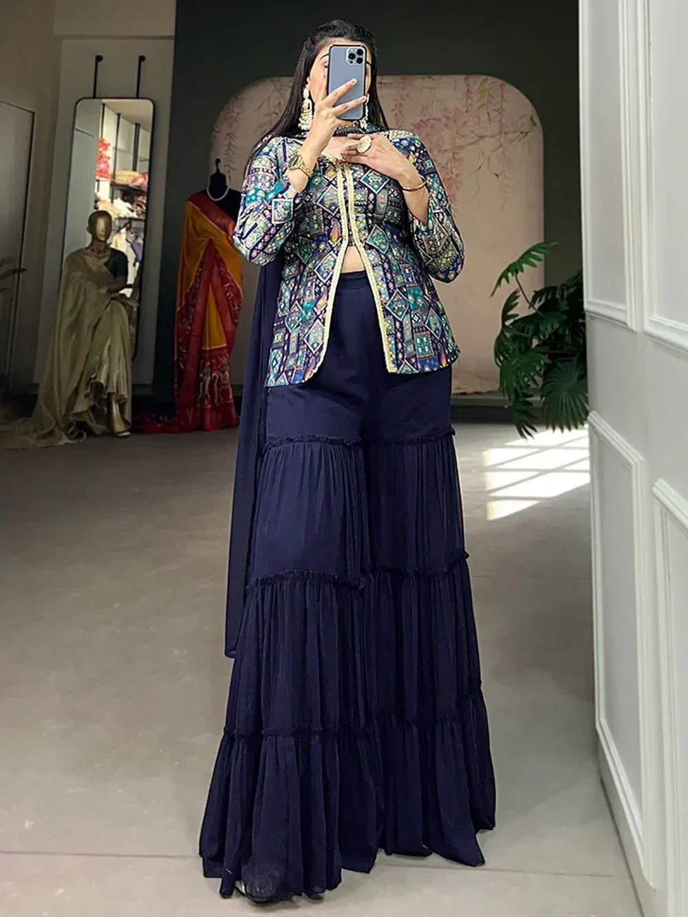Woman in printed ethnic jacket with navy tiered palazzo pants, Indian designer wear
