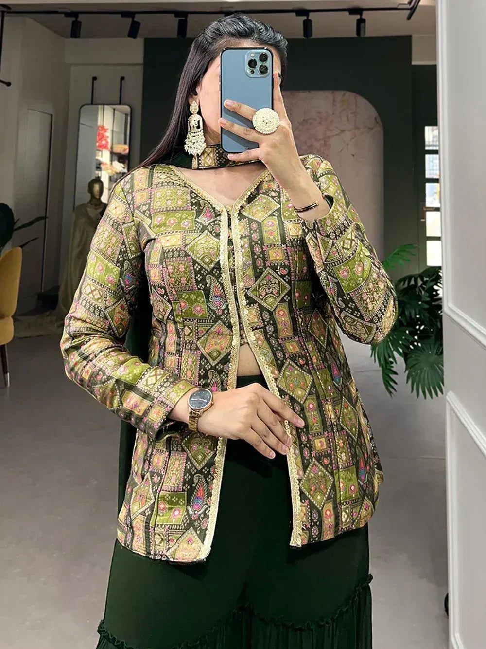 Green printed ethnic jacket with gold trim, paired with matching palazzo pants, perfect for Indian festive wear.