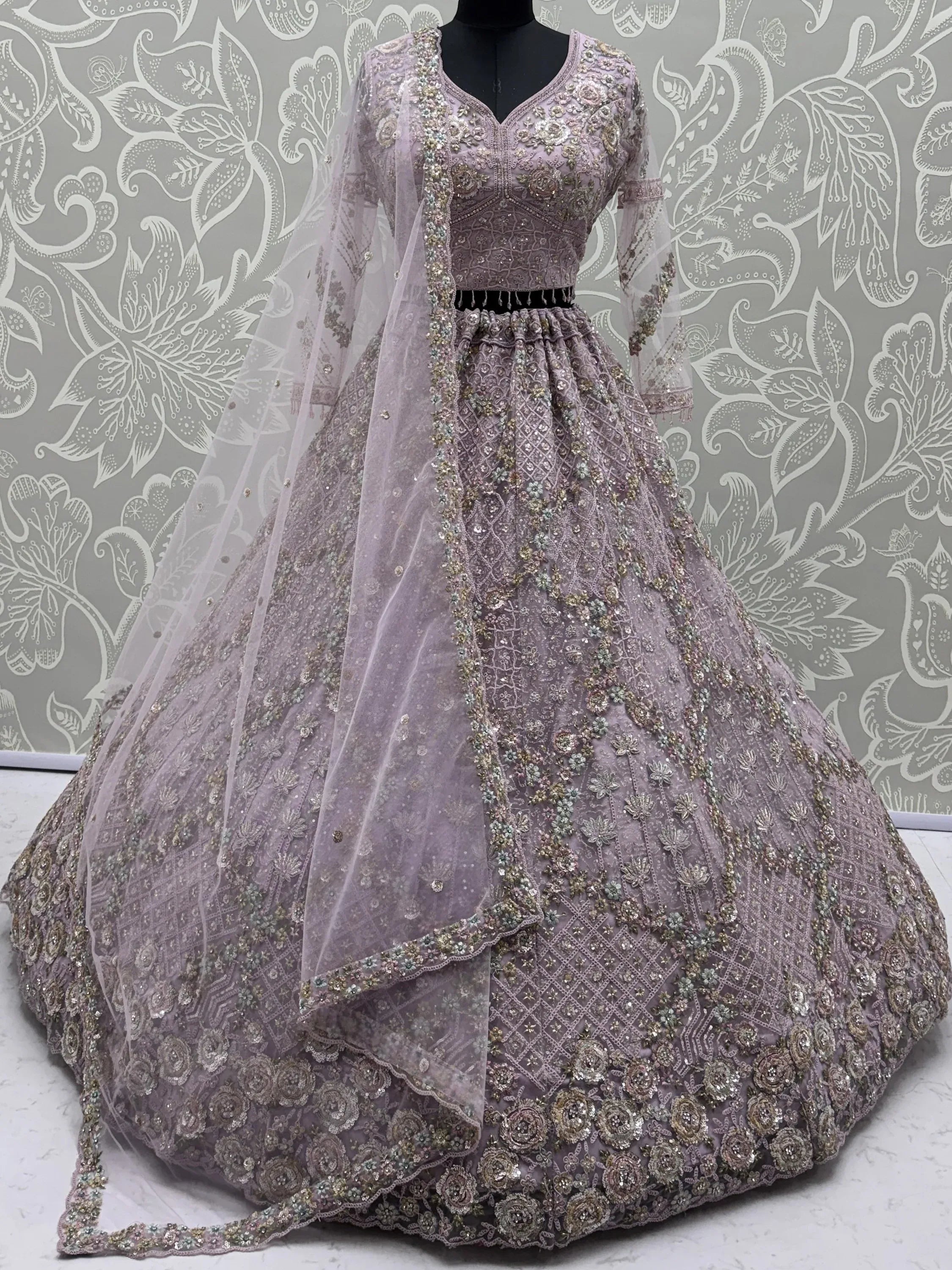 Notable Mauve Multi Thread Work Net Reception Wear Lehenga With Blouse