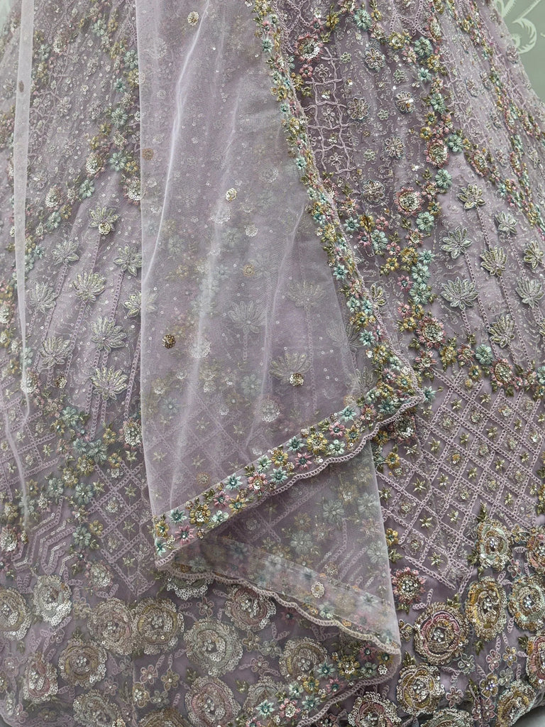 Notable Mauve Multi Thread Work Net Reception Wear Lehenga With Blouse