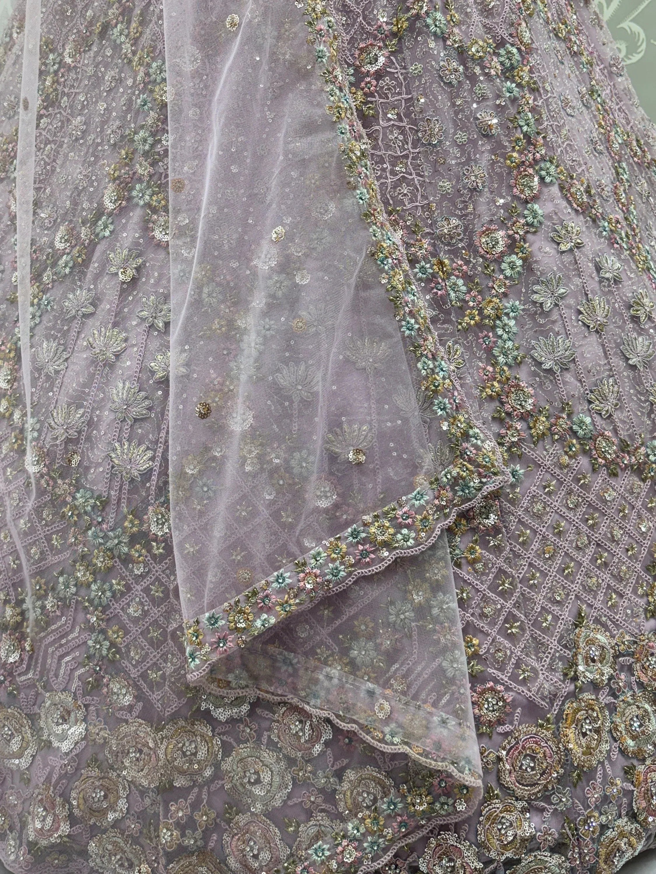 Notable Mauve Multi Thread Work Net Reception Wear Lehenga With Blouse