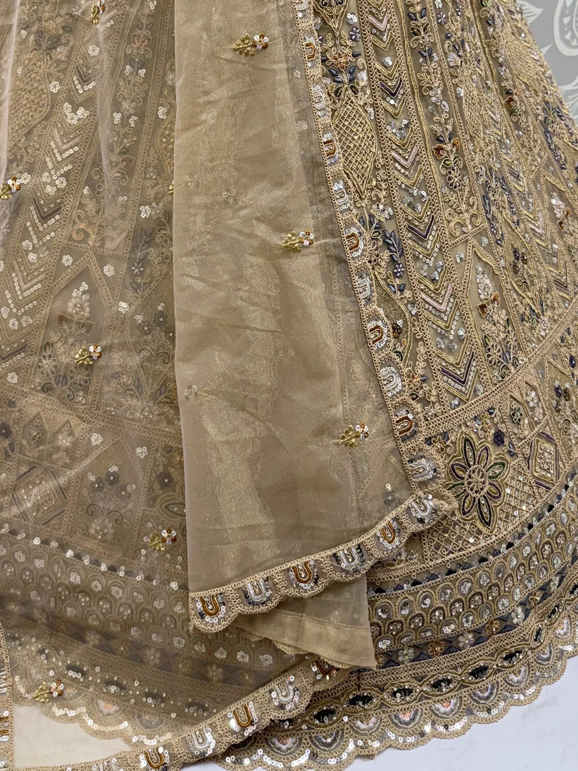 Shiny Beige Embroidered Net Reception Wear Lehenga Choli With Dupatta