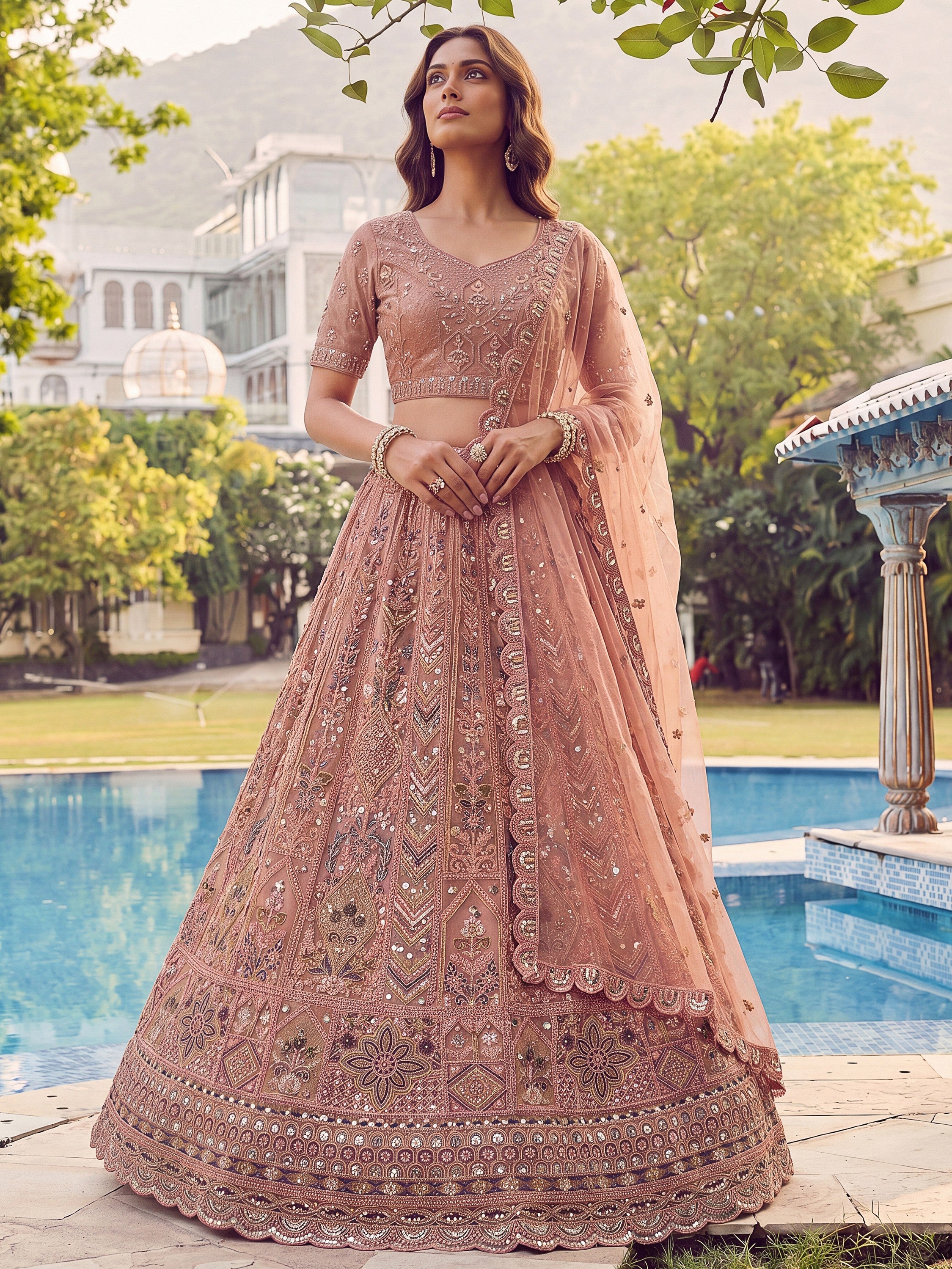 Glowing Peach Embroidered Net Wedding Wear Lehenga Choli with Dupatta